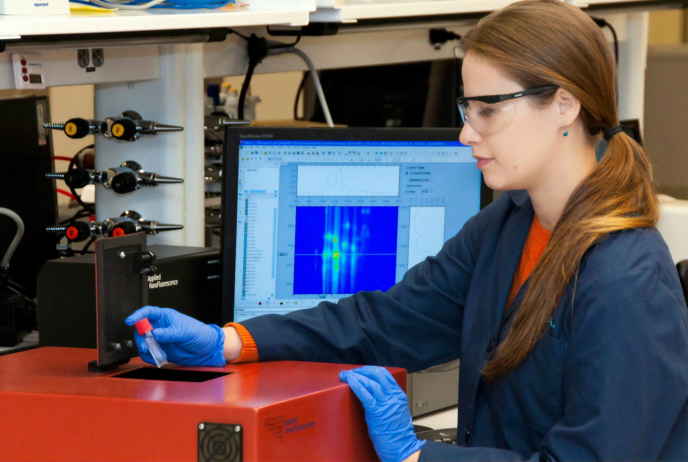 woman holding a test tube - Data Quality Management In Healthcare