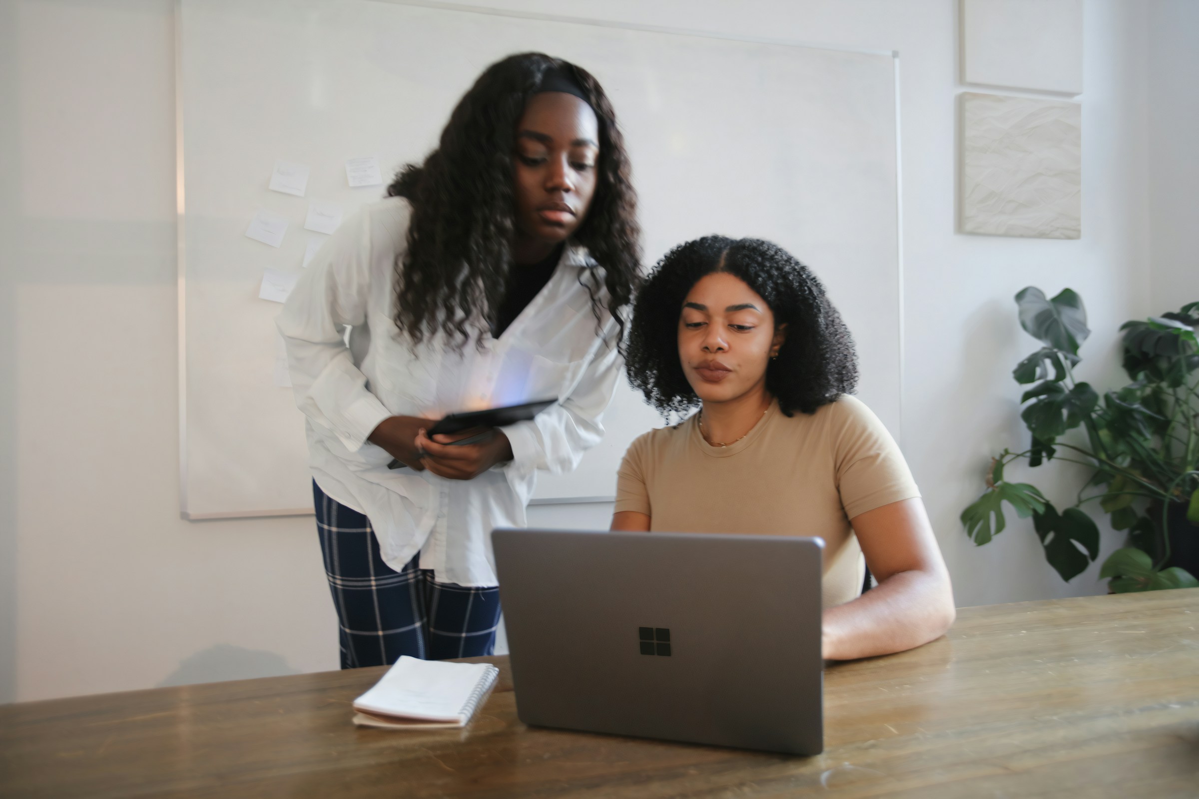 women on a phone - Data Quality Management In Healthcare