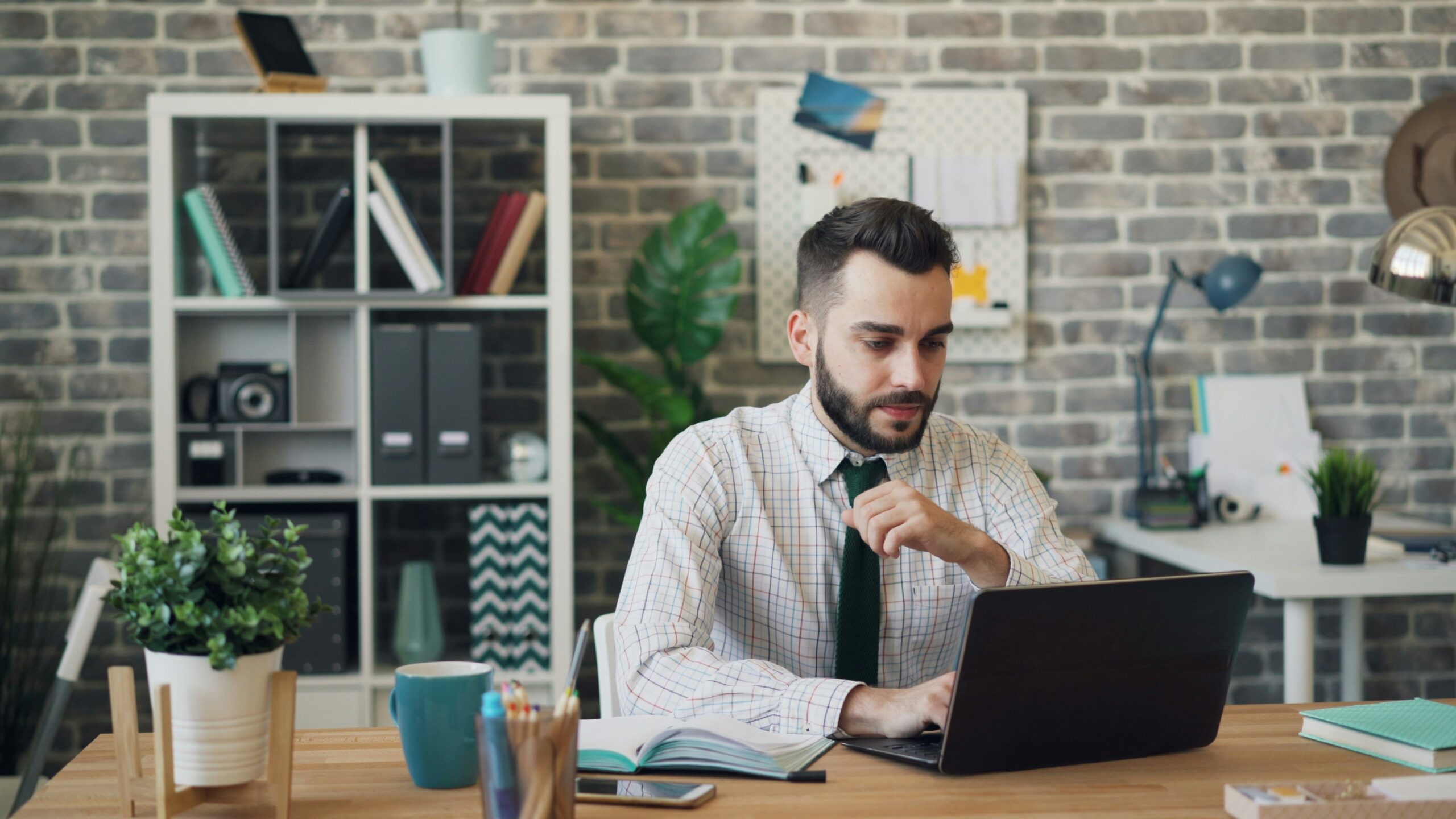 man on a laptop - Master Data Management Solution