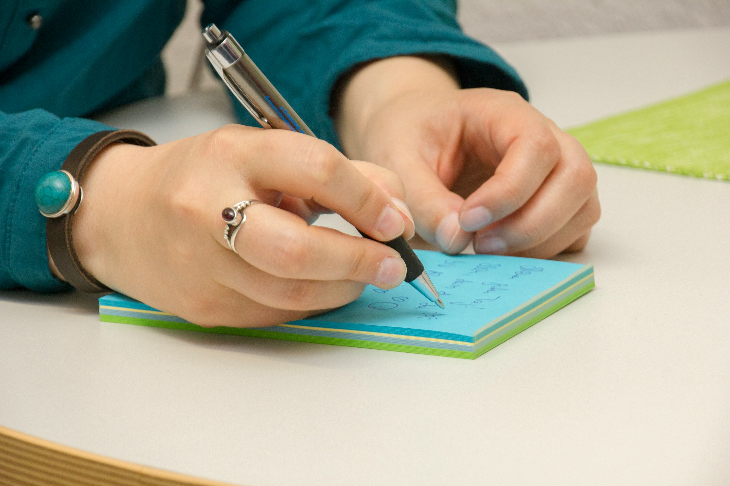 woman making notes - Healthcare IT Consultant 