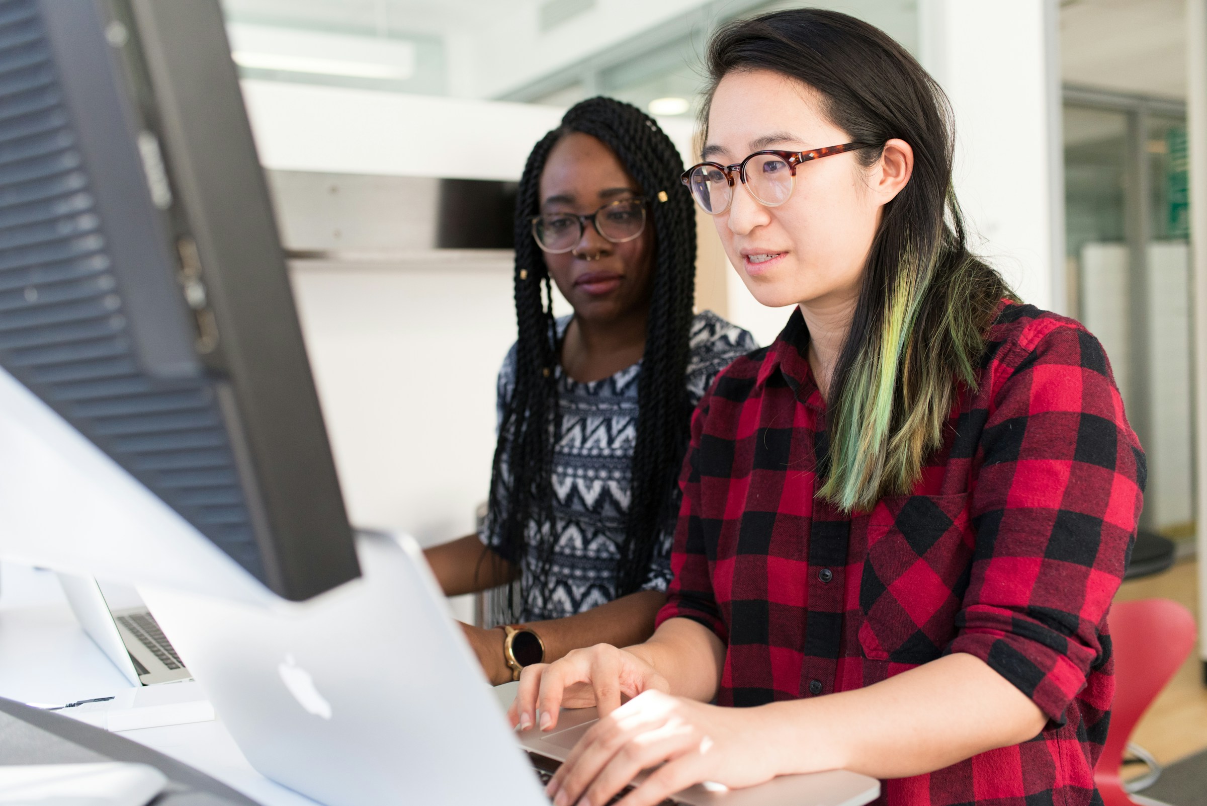 woman on a desktop - Hospital Credentialing Requirements