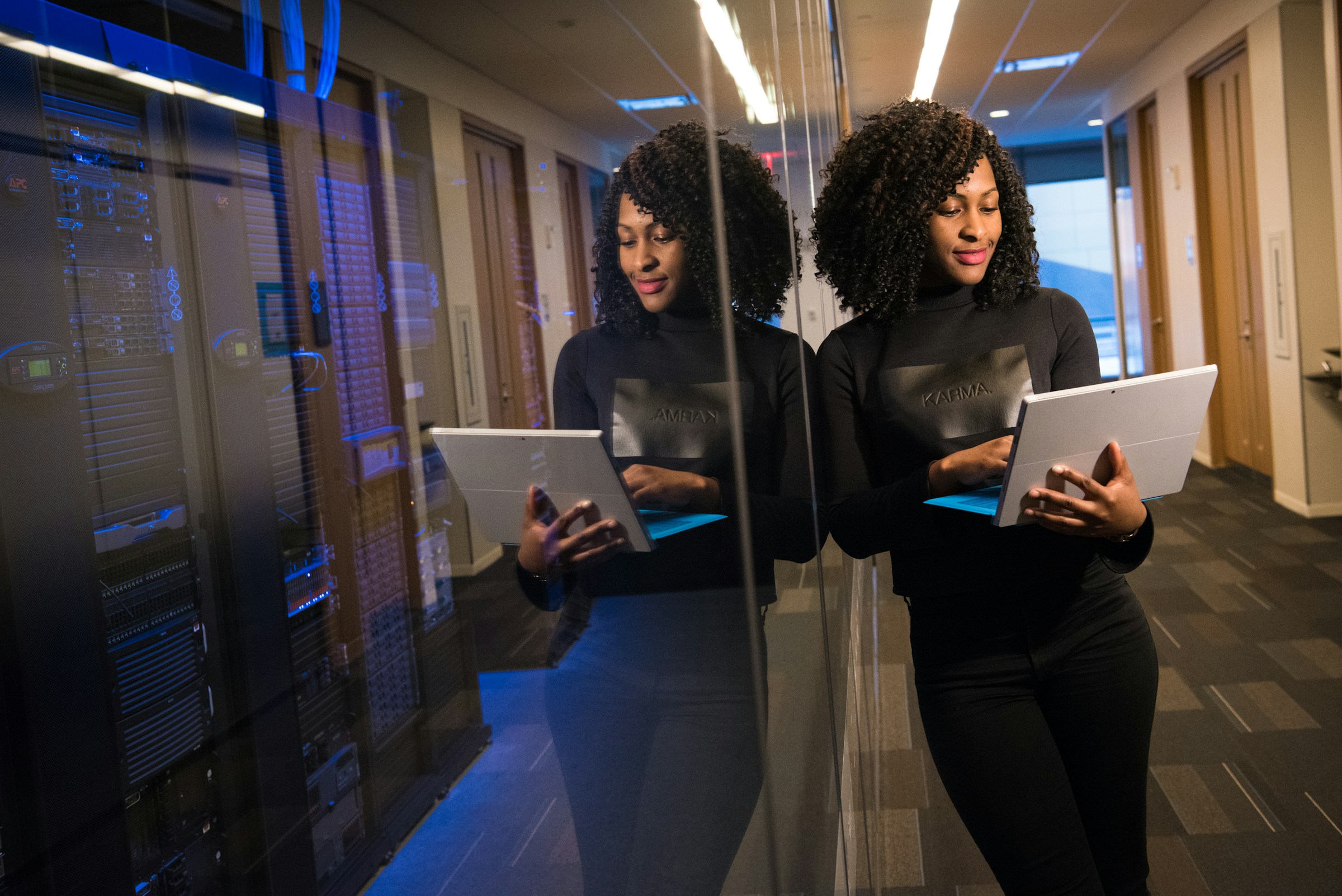 woman holding a laptop - How to Hire Data Scientists