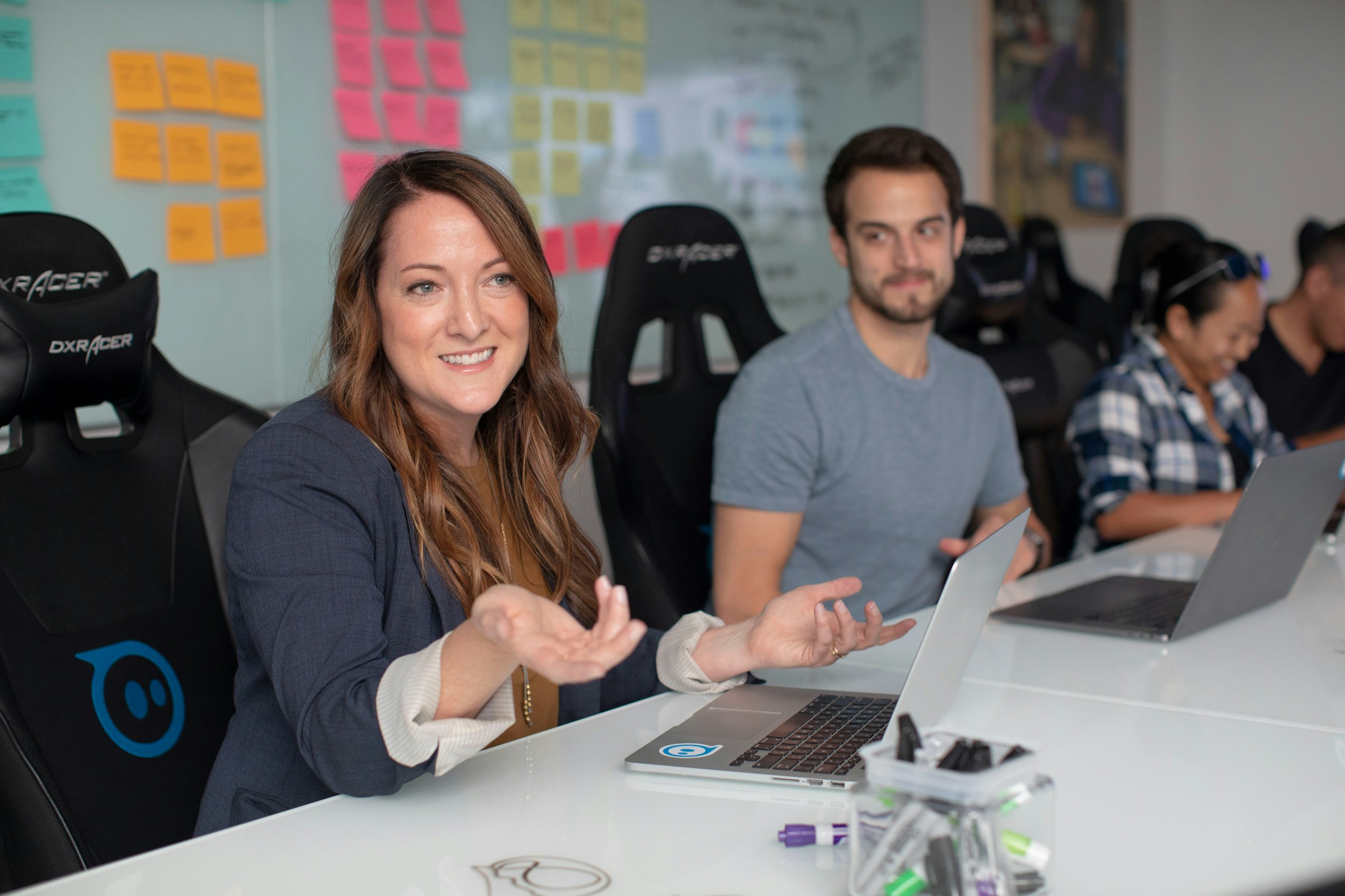 woman in a meeting - Project Executive vs Project Manager 