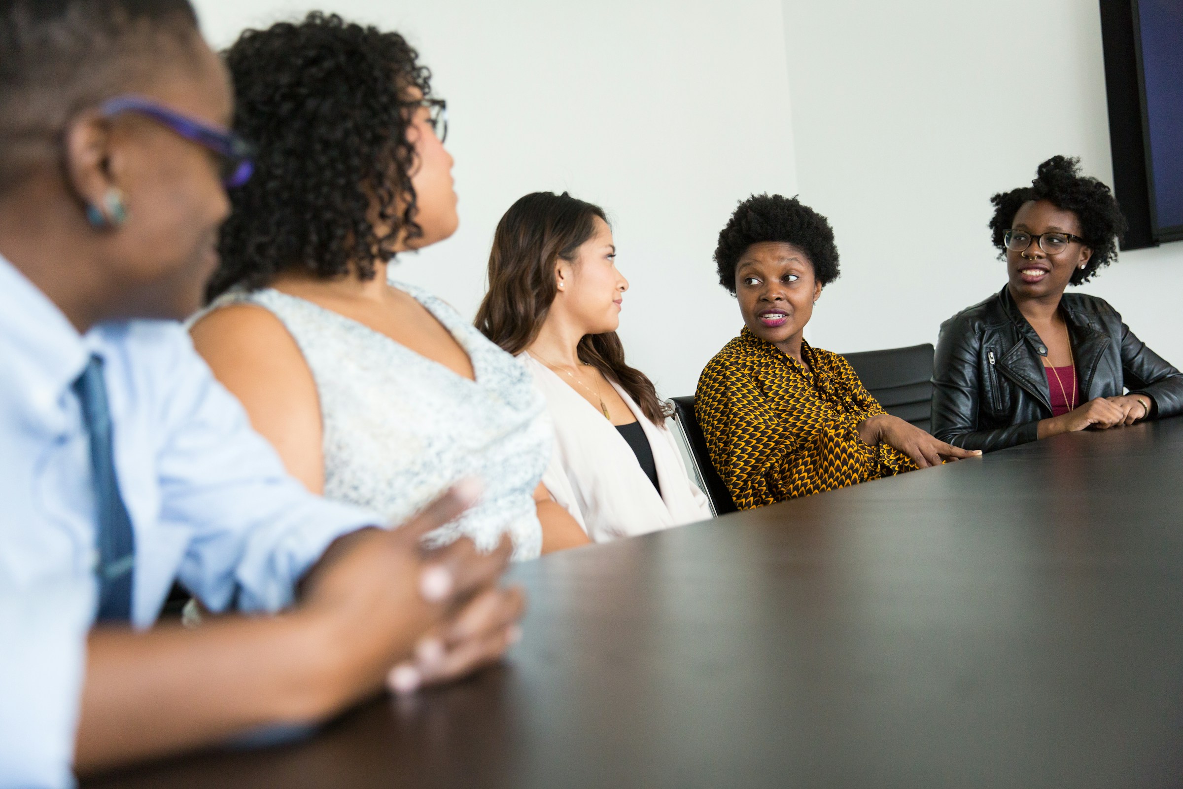 employees in a meeting - Scrum Master Recruitment Agencies