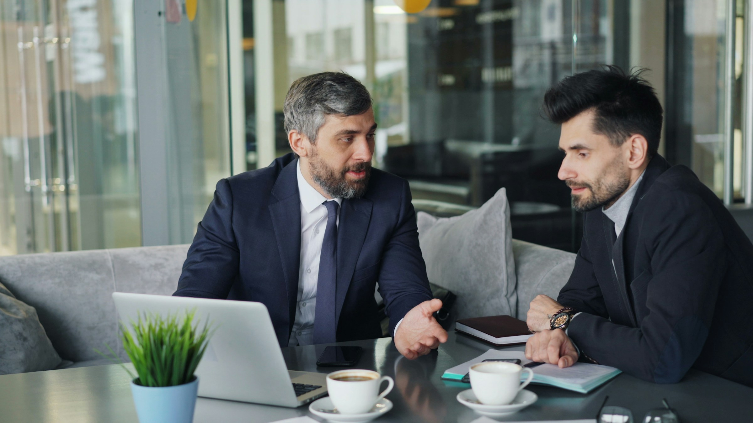 employees having a chat - Scrum Master Recruitment Agencies